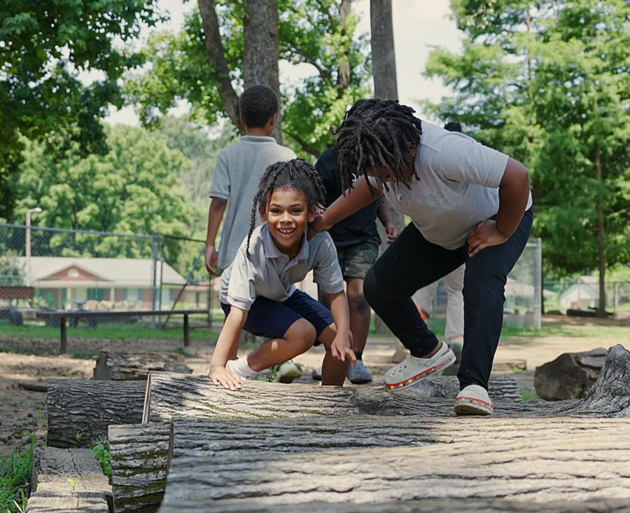Students playing outside at a partner school